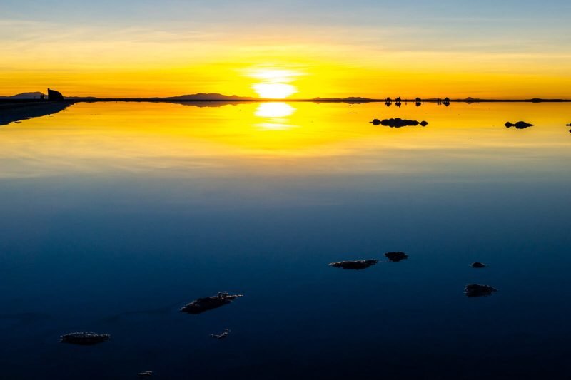 The sunrise reflections at the Salar de Uyuni in Bolivia